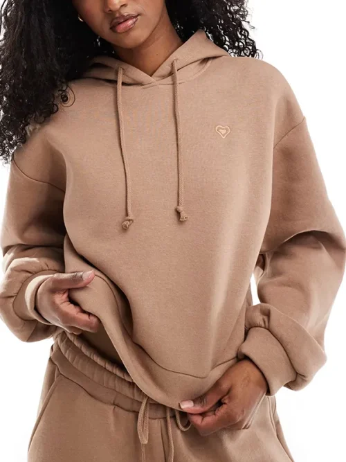 Light brown soft-textured hoodie custom with heart embroidery